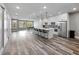 Spacious open floorplan with a kitchen, island seating, dining area, and hardwood flooring at 783 Blackberry Trl, Lawrenceville, GA 30043
