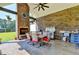 Outdoor patio with a brick fireplace, seating area, grill, and stainless steel sink at 783 Blackberry Trl, Lawrenceville, GA 30043