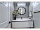 This powder room is equipped with a vessel sink, vanity and decorative mirror at 783 Blackberry Trl, Lawrenceville, GA 30043