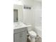Clean bathroom features a gray vanity with a white countertop, and a tub-shower combination at 2008 Main Nw St, Atlanta, GA 30318