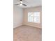 Airy bedroom featuring a ceiling fan and a large window, enhanced by neutral paint and soft carpeting at 2008 Main Nw St, Atlanta, GA 30318