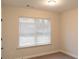 Bright bedroom with a large window offering natural light, and plush carpeting at 2008 Main Nw St, Atlanta, GA 30318