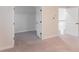 Spacious bedroom with an open closet, neutral carpet, and two doors, with a light and airy atmosphere at 2008 Main Nw St, Atlanta, GA 30318