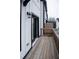 Outdoor deck area with wood floors and railing, with white and black trim exterior at 2008 Main Nw St, Atlanta, GA 30318