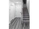 Bright hallway with stairs, leading to the upper levels of the home at 2008 Main Nw St, Atlanta, GA 30318