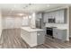 Kitchen featuring stainless steel appliances, grey cabinets, and a granite kitchen island at 2008 Main Nw St, Atlanta, GA 30318