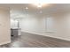 Spacious living room area with hardwood floors and lots of natural light from the window at 2008 Main Nw St, Atlanta, GA 30318