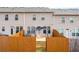 View of the backyard featuring a wooden fence, patio, and the exterior of the home at 2230 Mulsanne Dr, Lithonia, GA 30058