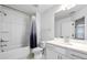 Bathroom featuring a tub with shower, vanity with sink and white countertop at 2230 Mulsanne Dr, Lithonia, GA 30058
