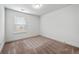 Bedroom with a large window and neutral carpeting providing plenty of natural light at 2230 Mulsanne Dr, Lithonia, GA 30058