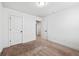 Bedroom with a large window and neutral carpeting providing a comfortable space at 2230 Mulsanne Dr, Lithonia, GA 30058