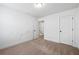 Bedroom with neutral carpeting; in need of some TLC at 2230 Mulsanne Dr, Lithonia, GA 30058