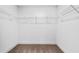 Empty walk-in closet with carpeted floor and wire shelving for optimal storage at 2230 Mulsanne Dr, Lithonia, GA 30058