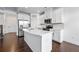 Modern kitchen with white cabinets, stainless steel appliances, island, and granite countertops at 2230 Mulsanne Dr, Lithonia, GA 30058