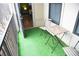Cozy balcony with artificial grass and a small table with chairs, ideal for relaxing outdoors at 898 Oak Sw St # 1410, Atlanta, GA 30310