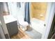 Well-lit bathroom with gray walls, tile shower, vanity and sink, and blue accents create a fresh, clean space at 898 Oak Sw St # 1410, Atlanta, GA 30310