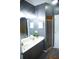 Updated bathroom showcasing a double sink vanity, shower, tile, and lots of light for a luxurious experience at 898 Oak Sw St # 1410, Atlanta, GA 30310