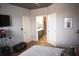 Stylish bedroom with decor, TV, a bathroom doorway, and modern design elements creates a relaxing retreat at 898 Oak Sw St # 1410, Atlanta, GA 30310