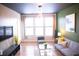 Bright living room featuring a large window with modern decor, connecting to stylish rooms at 898 Oak Sw St # 1410, Atlanta, GA 30310