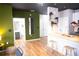 Stylish living space with wood-look floors and an open-concept design flowing into the kitchen and dining areas at 898 Oak Sw St # 1410, Atlanta, GA 30310
