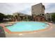 Community pool surrounded by lounge chairs and greenery, perfect for recreation and relaxation at 898 Oak Sw St # 1410, Atlanta, GA 30310