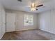 Cozy bedroom featuring neutral walls and a window with natural light at 9090 Dorsey Rd, Riverdale, GA 30274