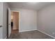 The bedroom boasts neutral walls and carpeted floors at 9090 Dorsey Rd, Riverdale, GA 30274