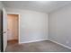 Bedroom with neutral walls and carpeted floors at 9090 Dorsey Rd, Riverdale, GA 30274