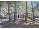 Cozy home facade with mature trees and a well-maintained yard at 9090 Dorsey Rd, Riverdale, GA 30274