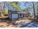 Charming single-story home featuring a one-car garage and traditional design at 9090 Dorsey Rd, Riverdale, GA 30274
