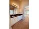 This bathroom features a large mirror, dual sinks, a soaking tub, and a shower at 2030 Calmwater Ct, Suwanee, GA 30024
