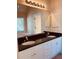 This bathroom features a large mirror, dual sinks, a soaking tub, and a shower at 2030 Calmwater Ct, Suwanee, GA 30024