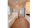 Bright bathroom boasts a soaking tub, walk-in shower, and dual sink vanity at 2030 Calmwater Ct, Suwanee, GA 30024