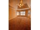 Spacious bedroom features a vaulted ceiling, a ceiling fan and multiple windows for natural light at 2030 Calmwater Ct, Suwanee, GA 30024