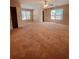 Spacious main bedroom with plush carpeting and plenty of natural light at 2030 Calmwater Ct, Suwanee, GA 30024
