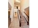 Bright foyer with tiled floor, carpeted stairs, and high ceilings at 2030 Calmwater Ct, Suwanee, GA 30024
