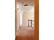A hallway features plush carpeting and an elegant staircase, inviting exploration of the home at 2030 Calmwater Ct, Suwanee, GA 30024