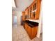 Well-lit kitchen with wood cabinets, stainless appliances, and tile floors at 2030 Calmwater Ct, Suwanee, GA 30024