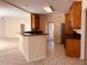 View of kitchen with breakfast bar, wood cabinetry, and stainless appliances at 2030 Calmwater Ct, Suwanee, GA 30024