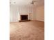 Inviting living room with a stone fireplace, paneled walls, and comfortable carpeting at 2030 Calmwater Ct, Suwanee, GA 30024