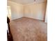 Empty living room features neutral walls, plush carpeting, and ample natural light at 2030 Calmwater Ct, Suwanee, GA 30024