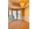 A living room illuminated by natural light with bay windows and wainscotting at 2030 Calmwater Ct, Suwanee, GA 30024