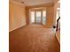 Bright and airy living room featuring neutral carpet and a bay window at 2030 Calmwater Ct, Suwanee, GA 30024