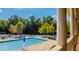 Inviting outdoor swimming pool with lounge chairs and umbrellas providing a resort-like experience at 2030 Calmwater Ct, Suwanee, GA 30024