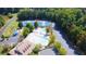 Aerial shot of the community pool, tennis courts, playground, and parking area at 2030 Calmwater Ct, Suwanee, GA 30024