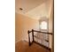 Elegant foyer staircase with a large arched window floods the space with natural light at 2030 Calmwater Ct, Suwanee, GA 30024