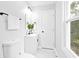 Stylish bathroom featuring a white vanity, modern fixtures, and a window view at 6539 Hayes Dr, Riverdale, GA 30274