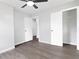Open bedroom with an attached closet, light gray walls, and wood floors throughout at 6539 Hayes Dr, Riverdale, GA 30274