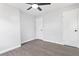 Clean, freshly painted bedroom with hardwood floors, neutral decor, and closet at 6539 Hayes Dr, Riverdale, GA 30274