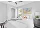 Bright bedroom with a plush bed, natural light, and a view of greenery outside at 6539 Hayes Dr, Riverdale, GA 30274